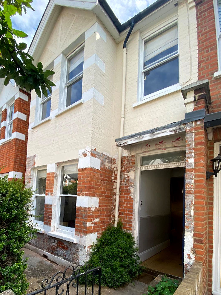 picture of a property with paint partly removed of the brickwork in barnes london